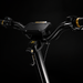 Close-up of electric scooter handlebars with a focus on the handlebar drops and RoleyX brand logo.
